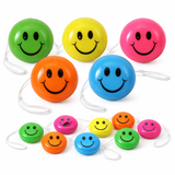 Colorful smiley face yoyos on white background